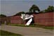 Piper Crashes Into T-Hangar at KDET Detroit City Airport
